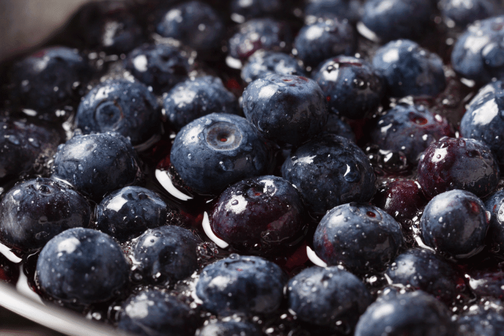  Close Up Of Blueberries Simmering In Pan 